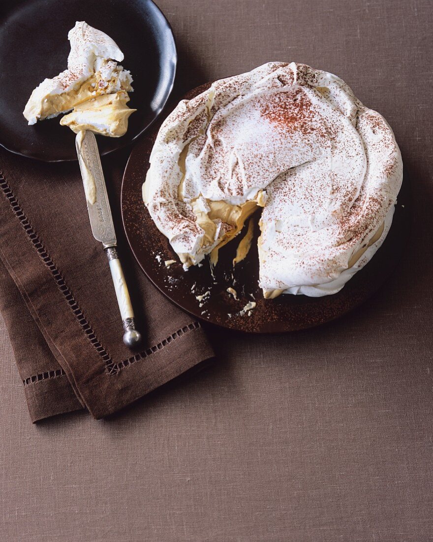 Layered meringue cake with coffee cream