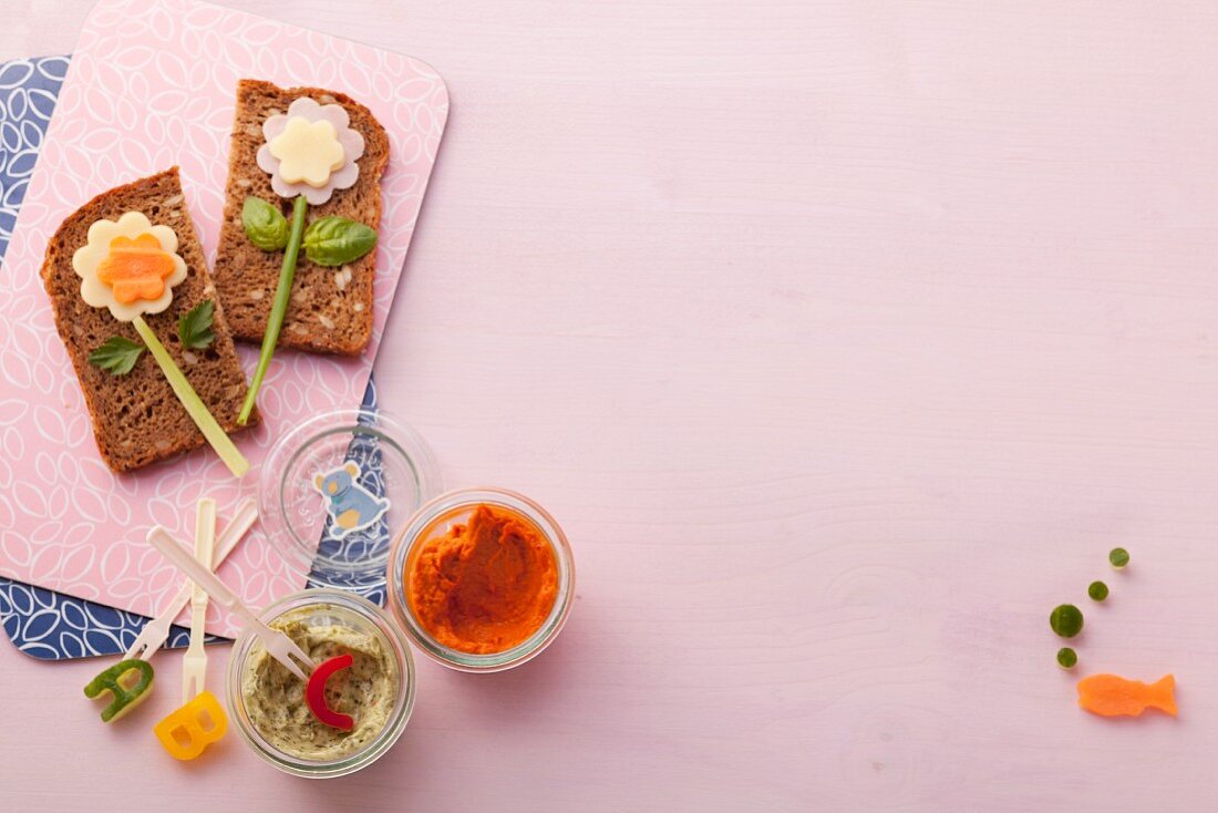 Wholemeal bread with cheese, pepper spread and herb spread