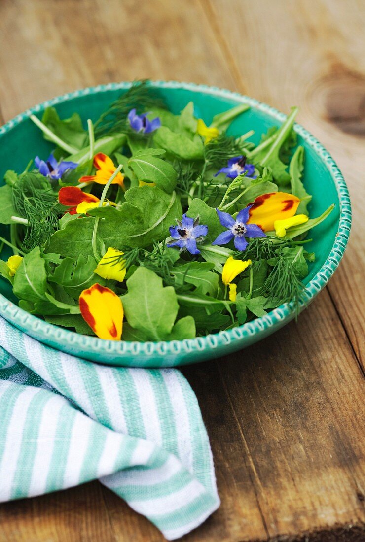 Rocket salad with edible flowers