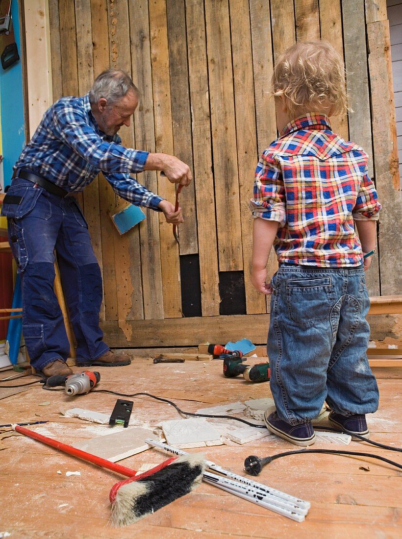 Grandfather and grandson doing D-I-Y