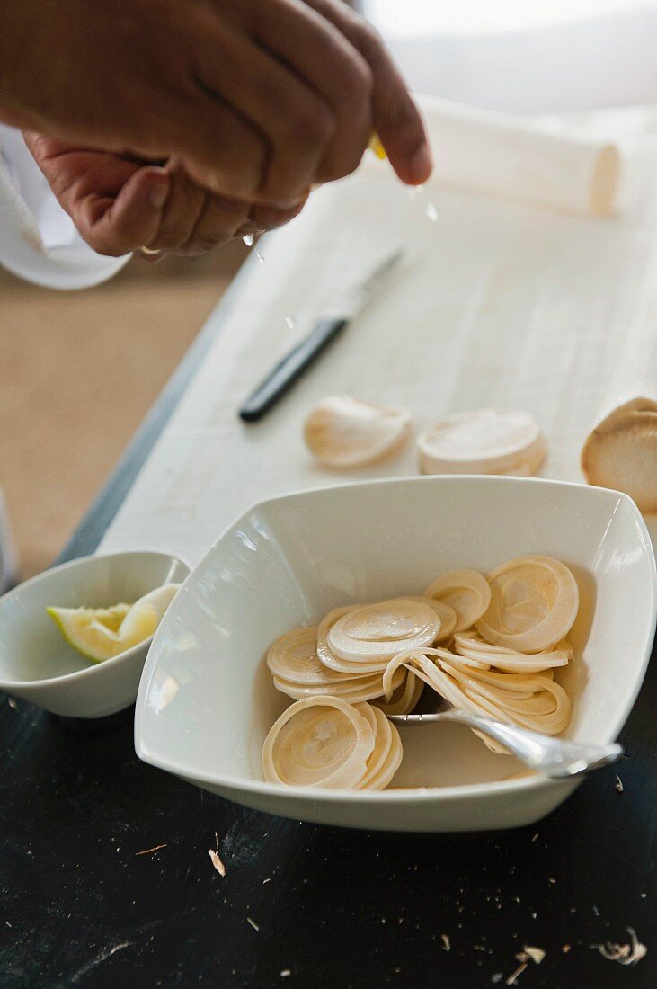 Sliced heart of palm drizzled with lemon juice