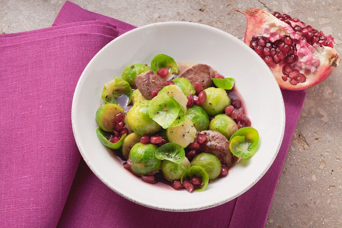 Sprouts with lamb and pomegranate seeds