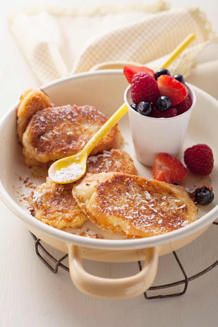 French toast with shredded coconut and fresh berries