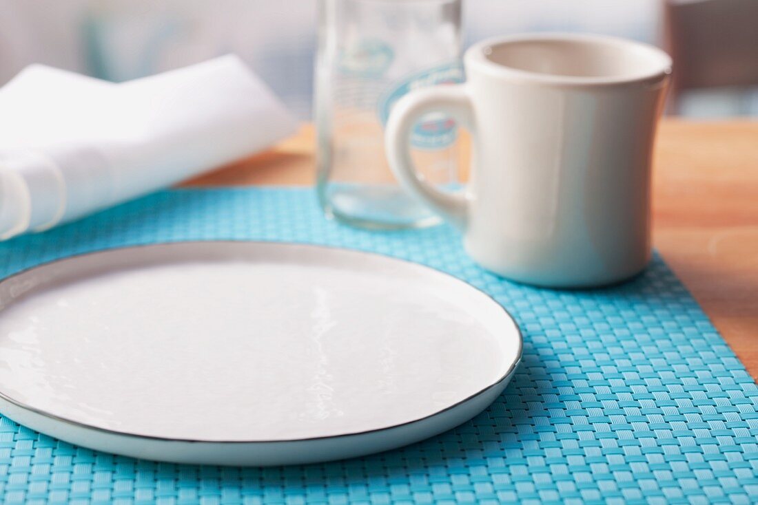 An empty plate and mug