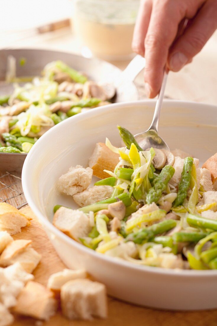 Preparing asparagus and bread bake