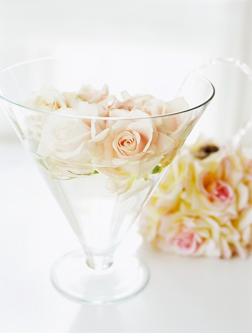 Glass vase with pink roses