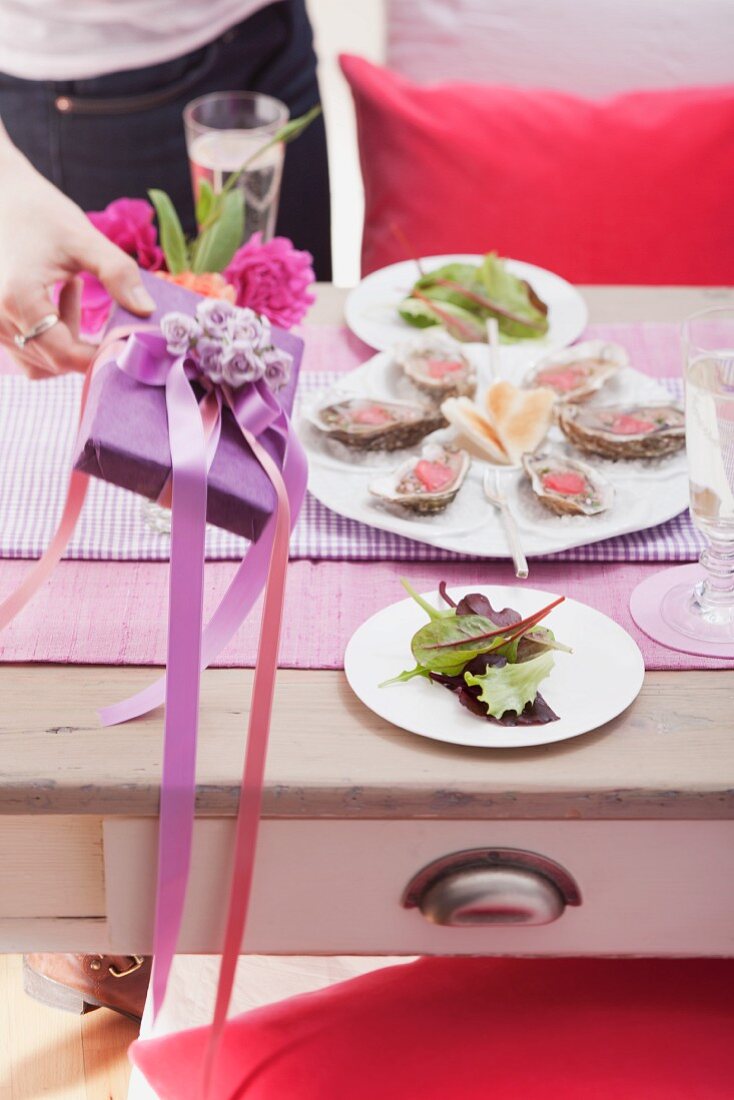 Table set for Valentine's Day with oysters