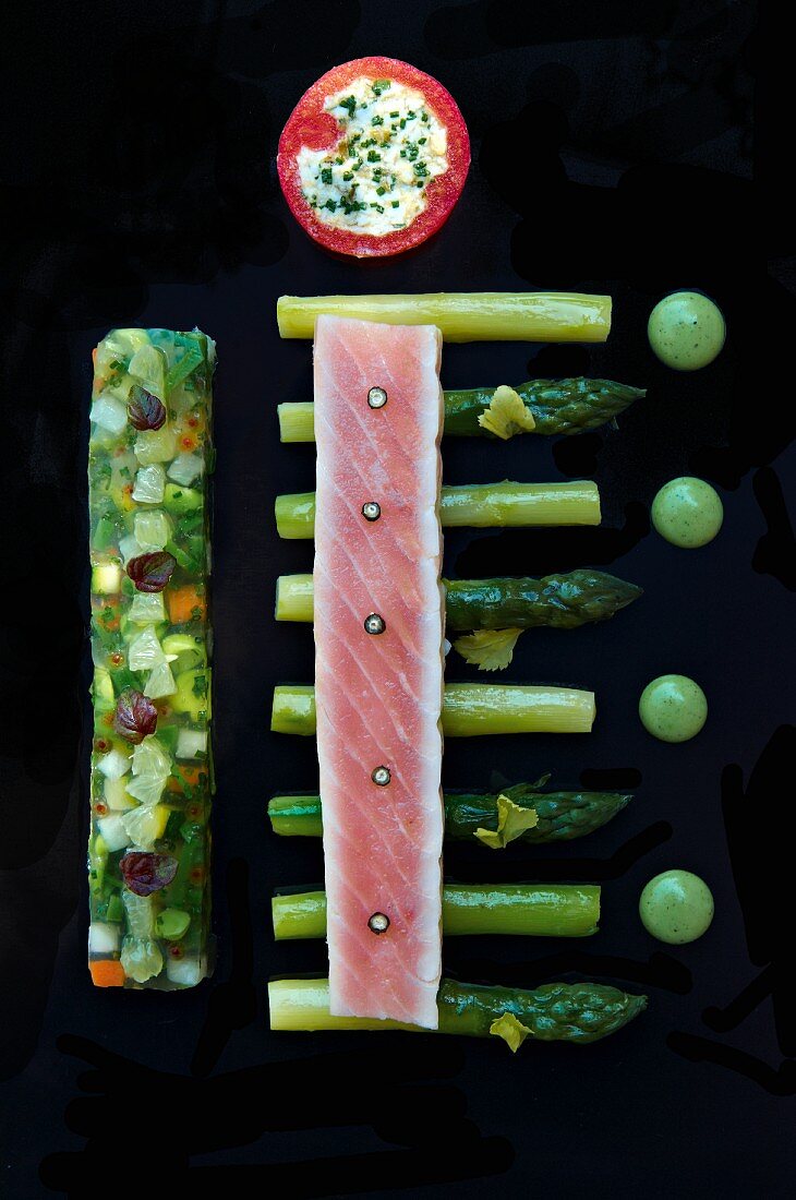 Salmon fillet on green asparagus with vegetable aspic