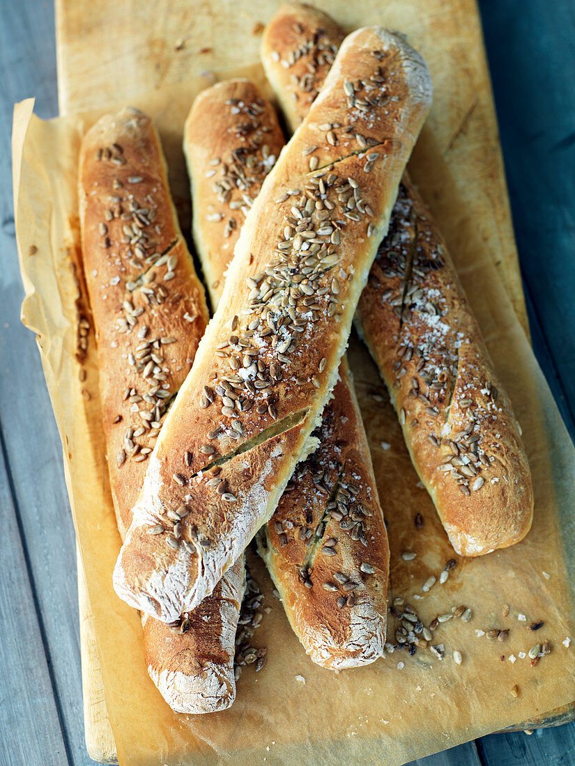 Four baguettes with sunflower seeds