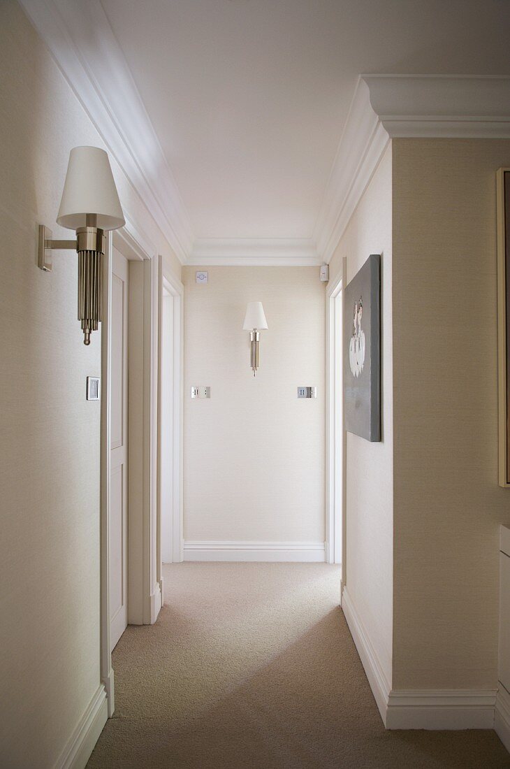 Traditional hallway with retro wall lamps