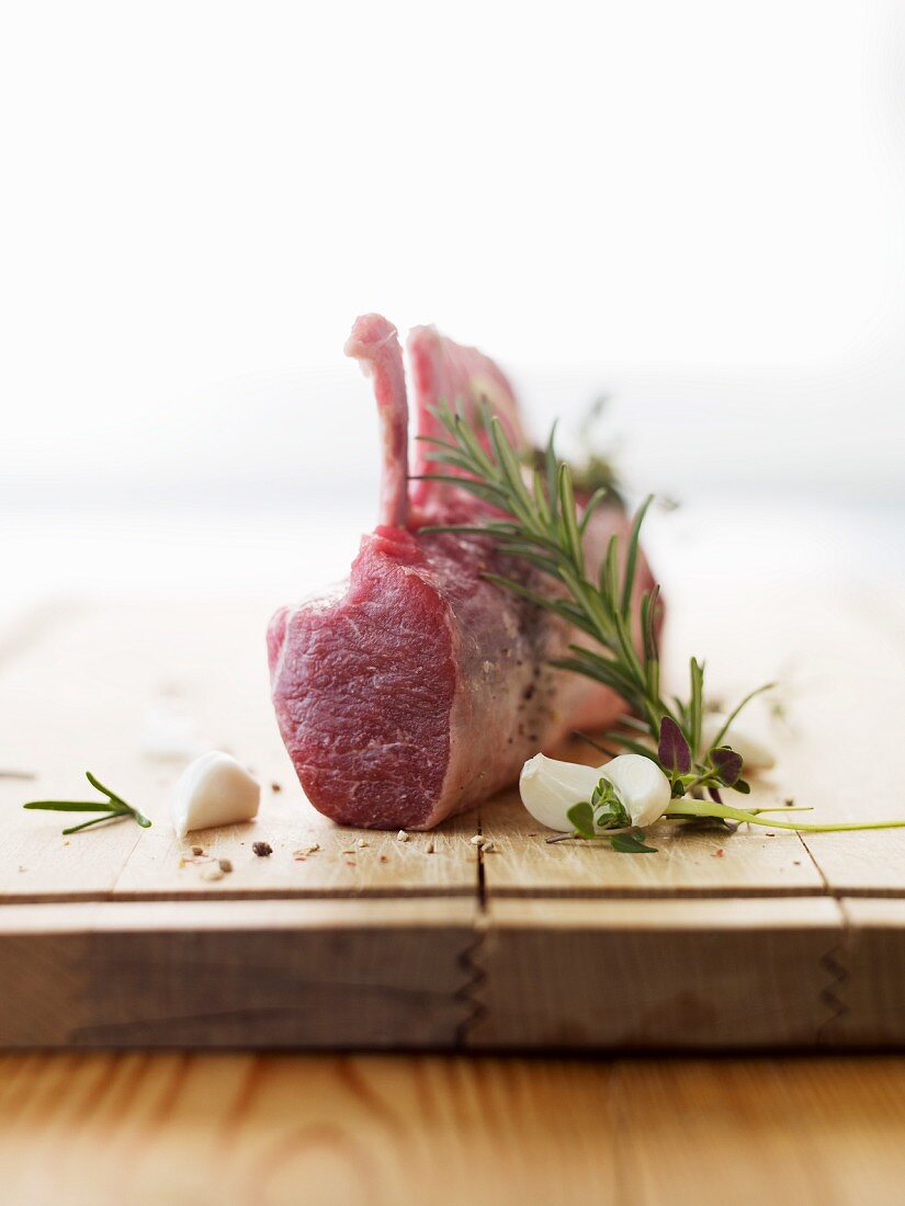 Raw lamb chops, garlic and rosemary