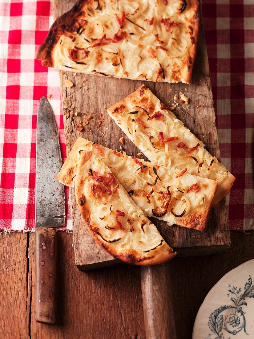 Tarte flambée with bacon and onions