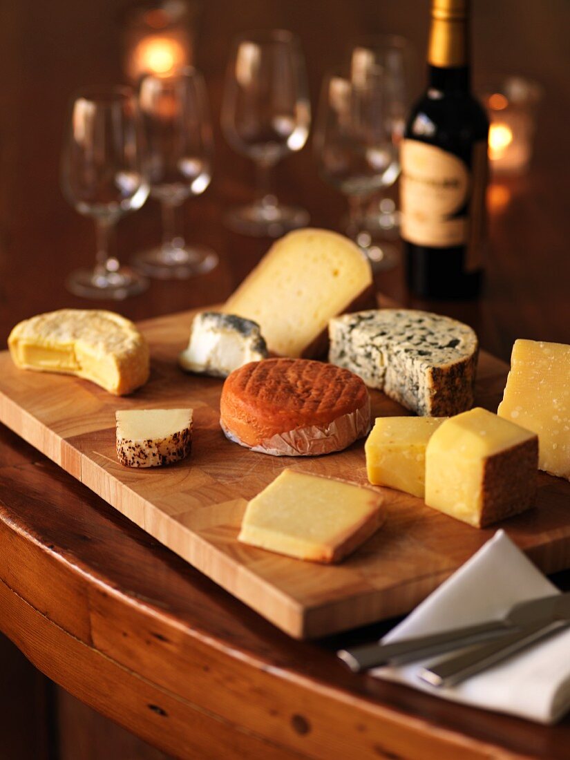 Assorted varieties of cheese and red wine