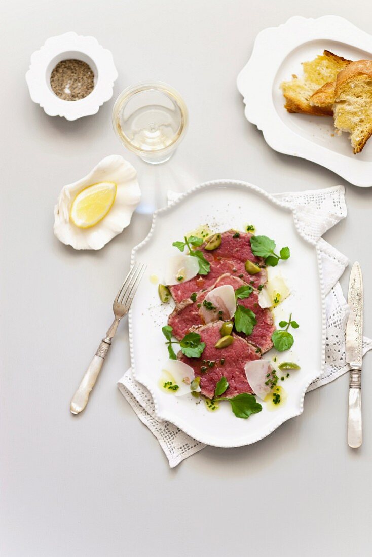 Beef carpaccio with parmesan and crostini
