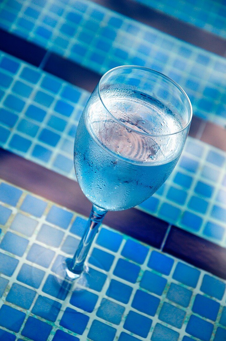A glass of water by the pool