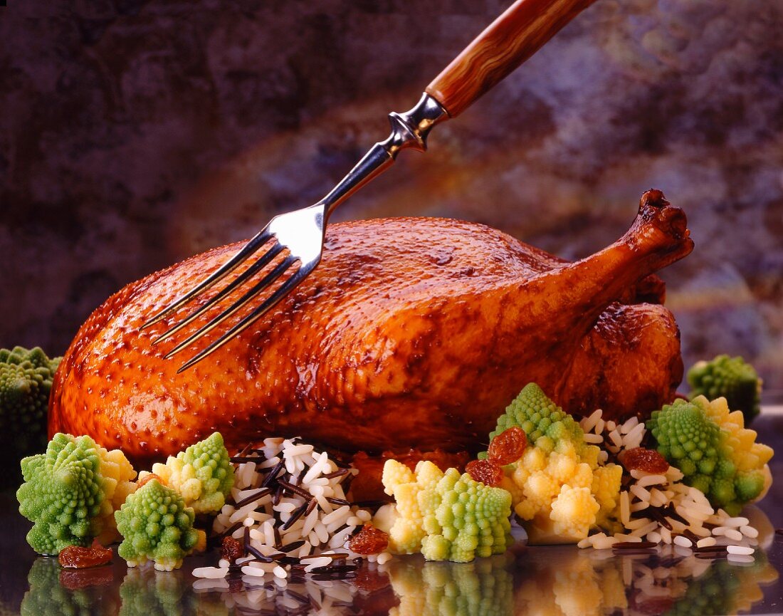 Roast duck on romanesco and wild rice