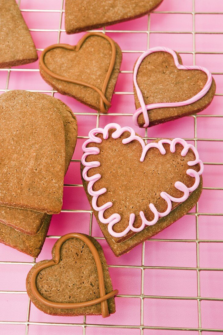 Heart-shaped cookies on a kitchen rack for Valentine's Day