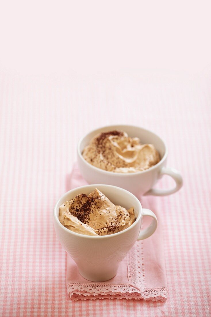 Cream desserts in two cups
