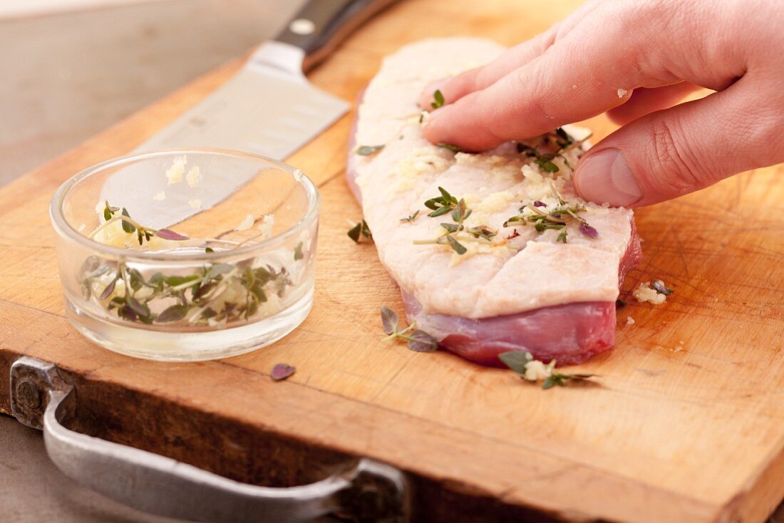 Rub the duck breast with a mixture of garlic and thyme