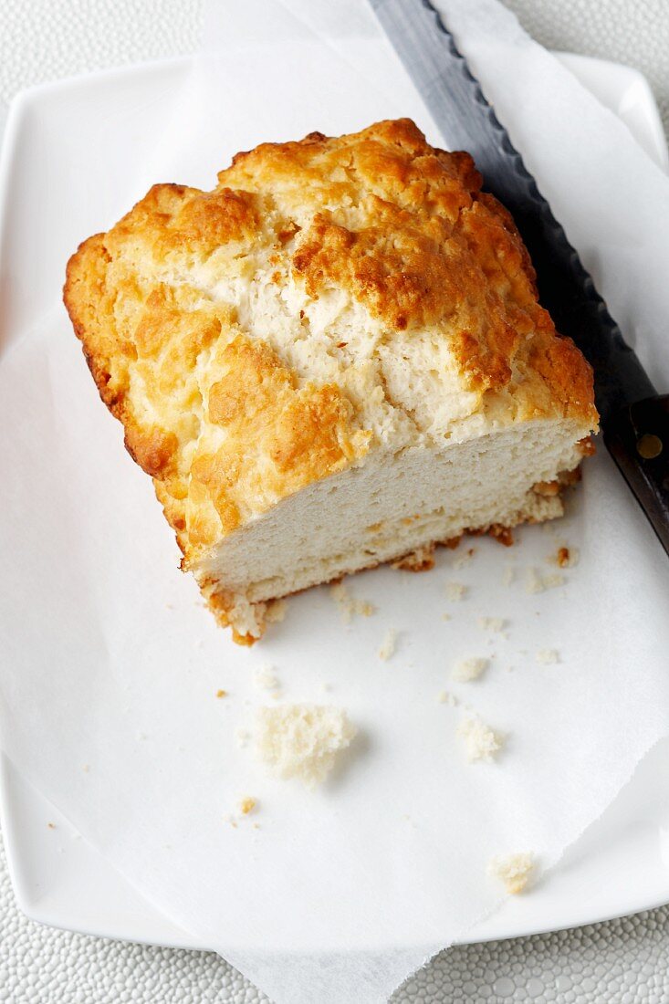 Half a Biscuit Loaf on a Dish; Knife