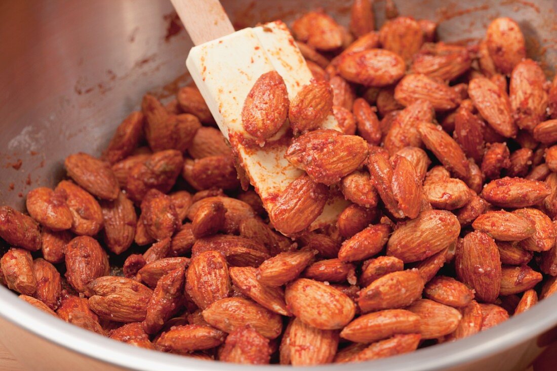 Making spiced sugar-toasted almonds