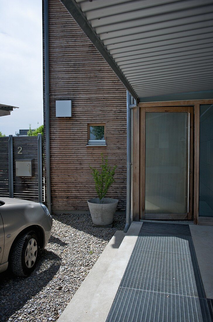 Roofed walkway and front door of contemporary house