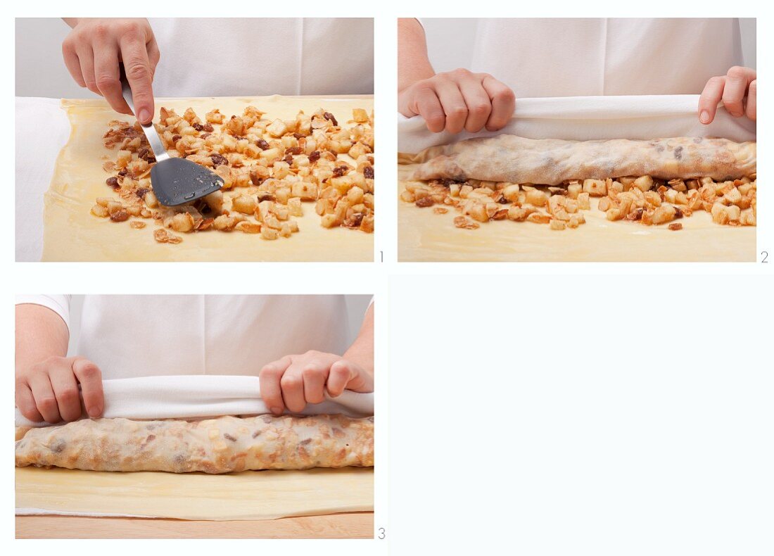 Preparing apple strudel: roll up filled strudel pastry