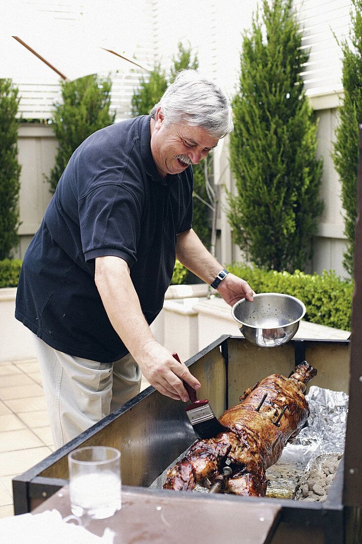 A man brushing a cochon de lait