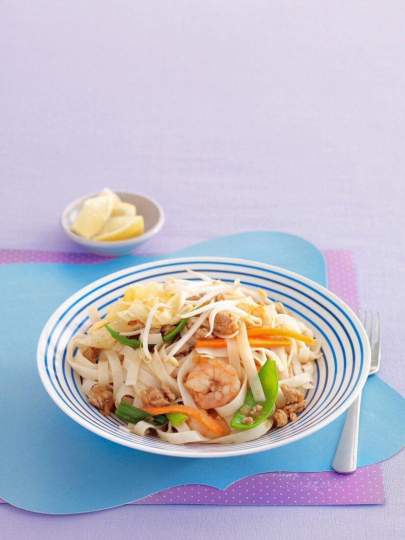 Pad Thai (fried rice noodles, Thailand) with vegetables and shrimp