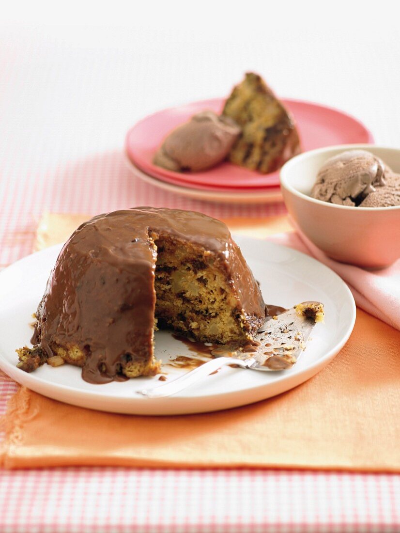 Baked fruit pudding with chocolate icing