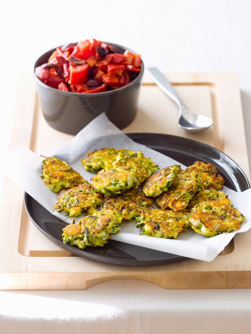 Courgette and feta fritters with tomato salad