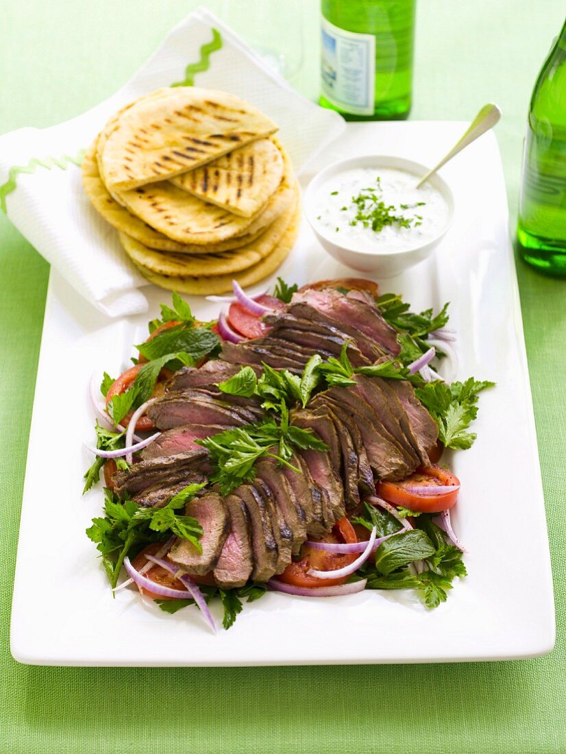 Lamb with tomato salad and minted yoghurt