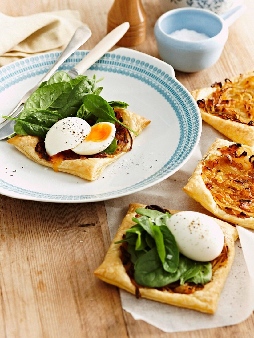 Onion tart with soft boiled eggs and spinach