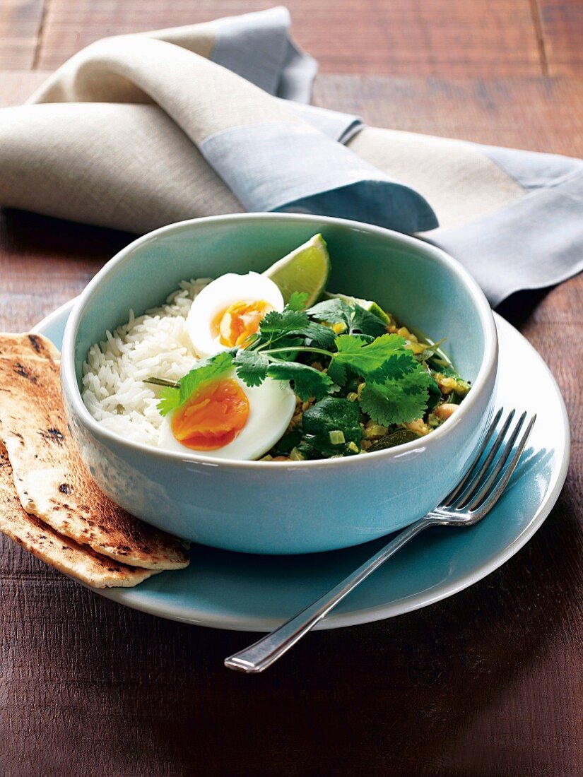 Lentil curry with egg, chick peas, spinach and rice