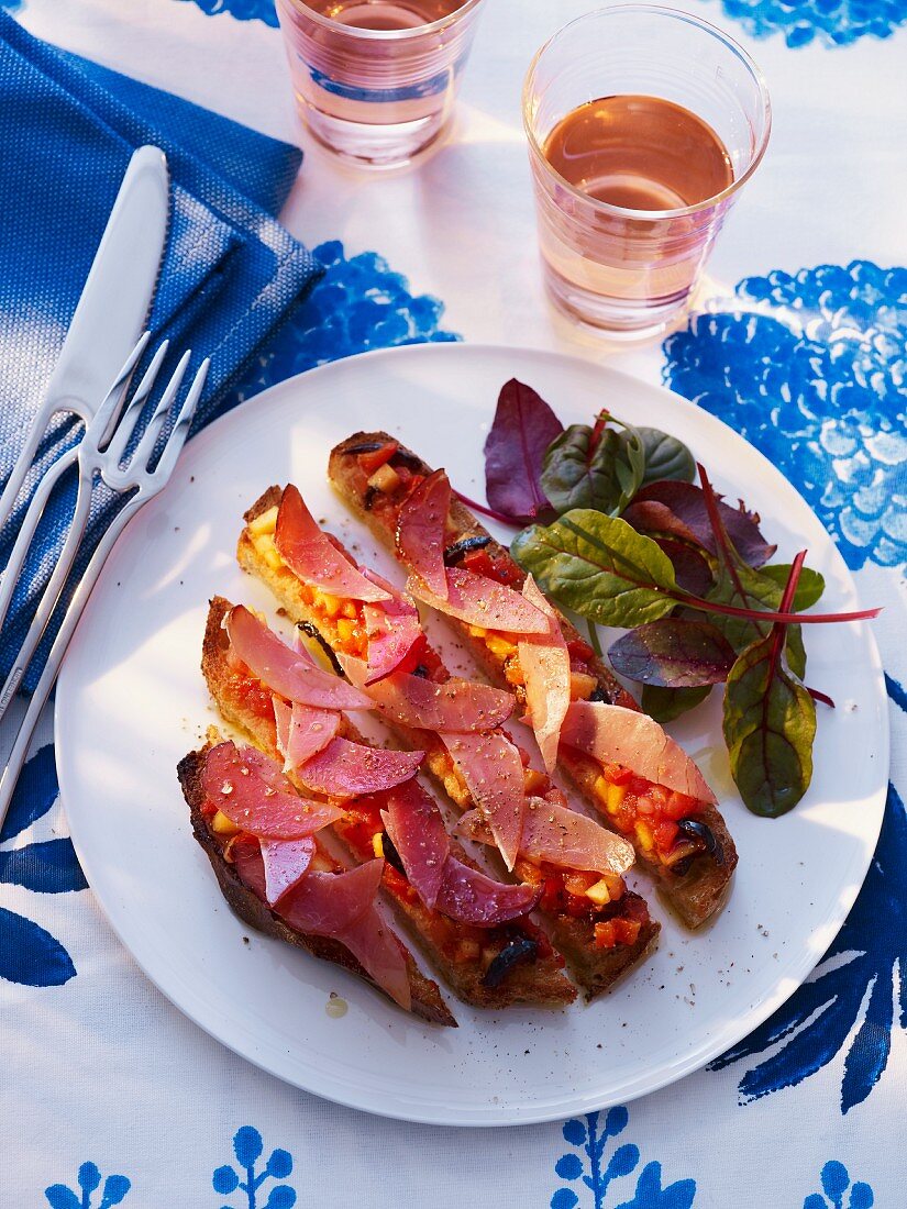 Bread topped with peaches and bacon