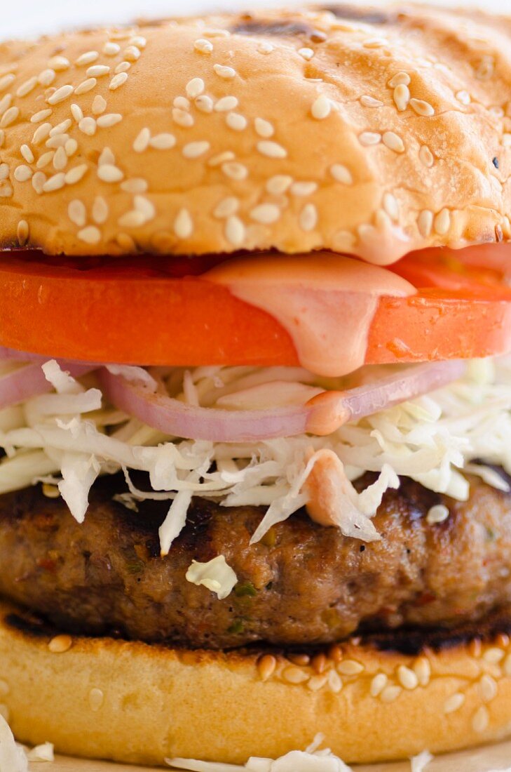 Burger with shredded white cabbage (close-up)