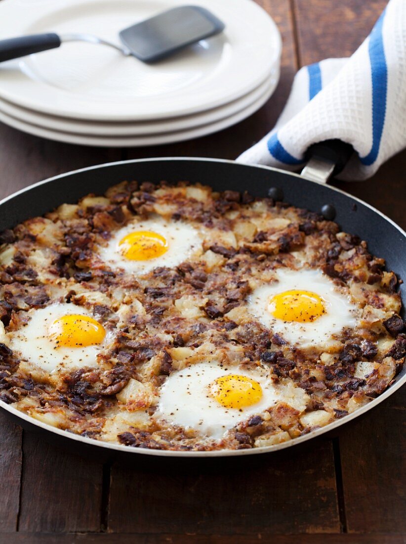 Beef and Potato Hash with Eggs; In a Skillet
