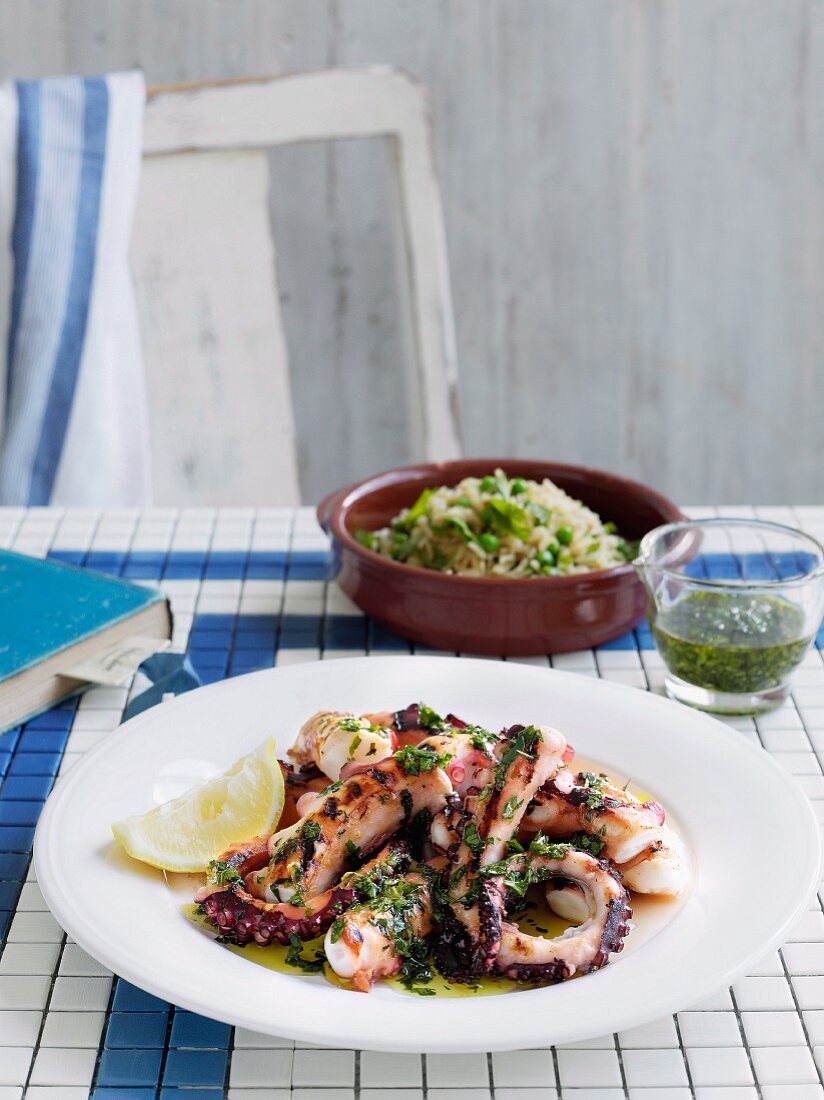 Octopus with Greek herb sauce and pea and mint pilaf
