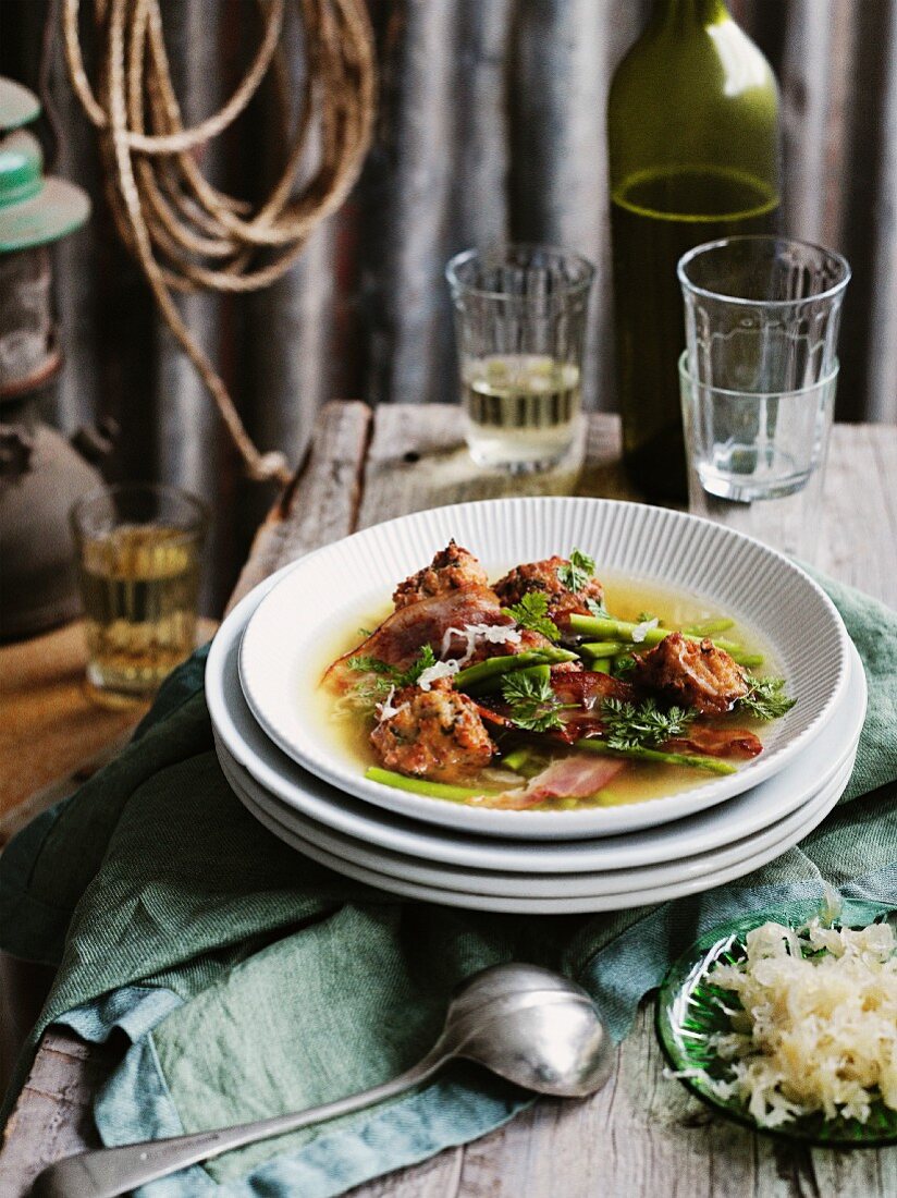 Bacon dumplings in broth made from smoked chicken and sauerkraut