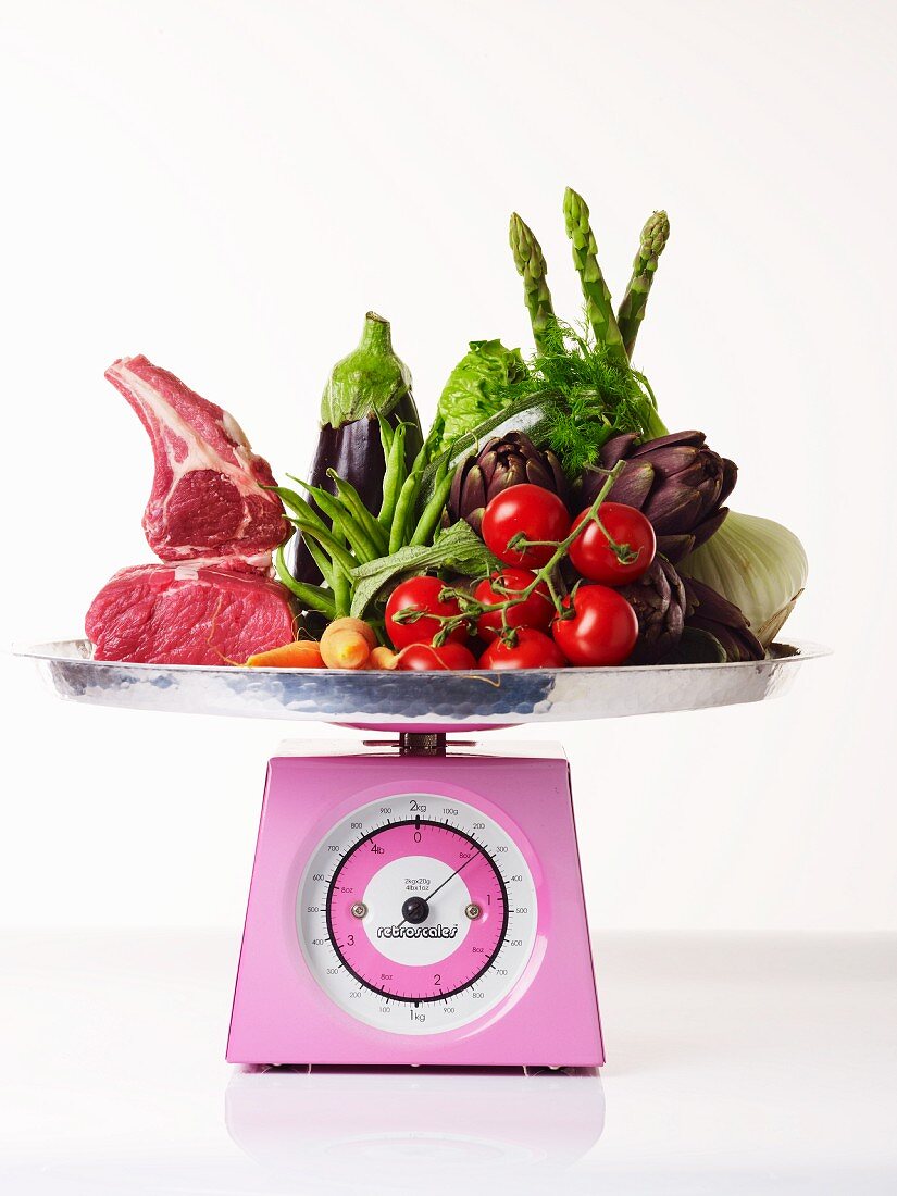 Food for a balanced diet on a kitchen scale