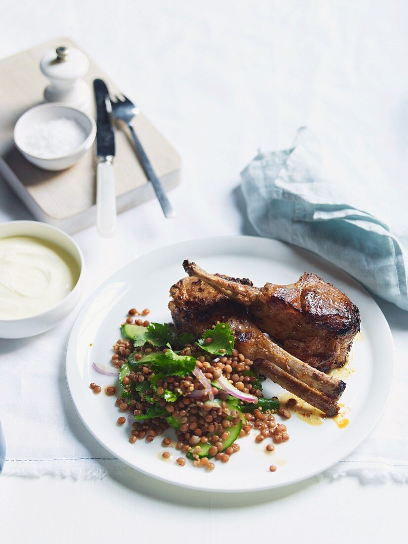 Tandoori lamb cutlets with red lentils, cilantro and yogurt