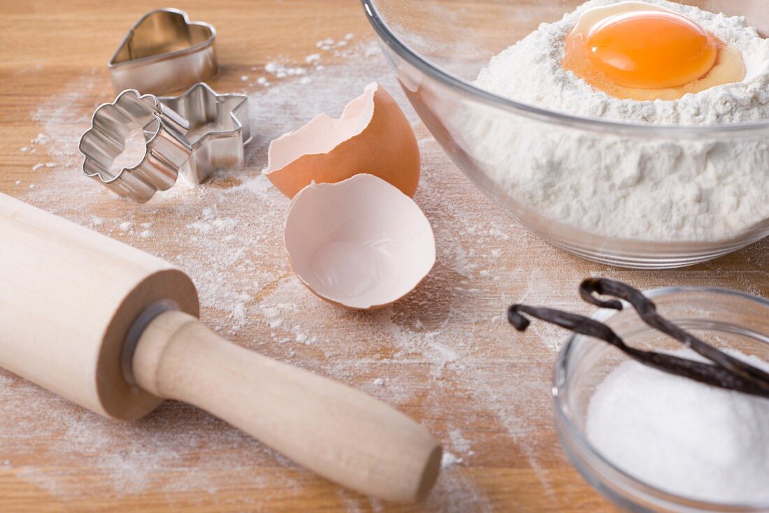 Assorted baking ingredients, cookie cutters and rolling pin