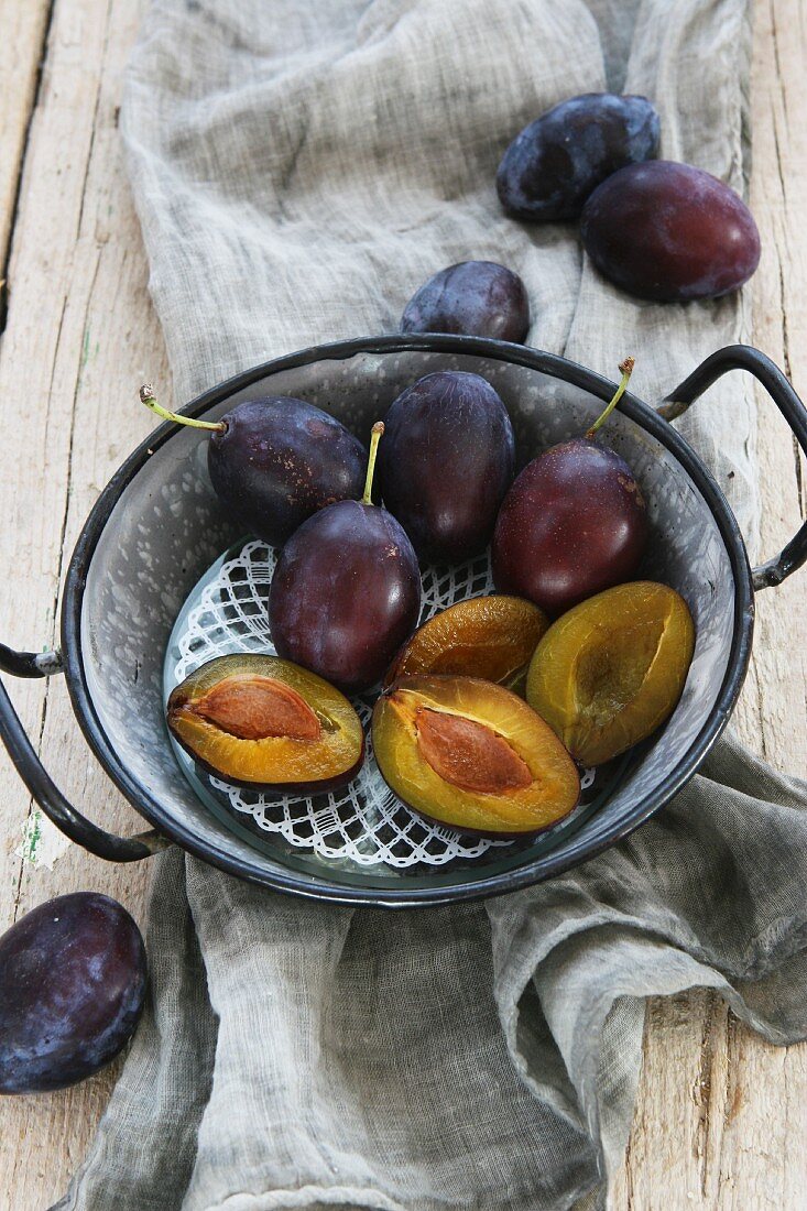 Plums in an old-fashioned enamel pot