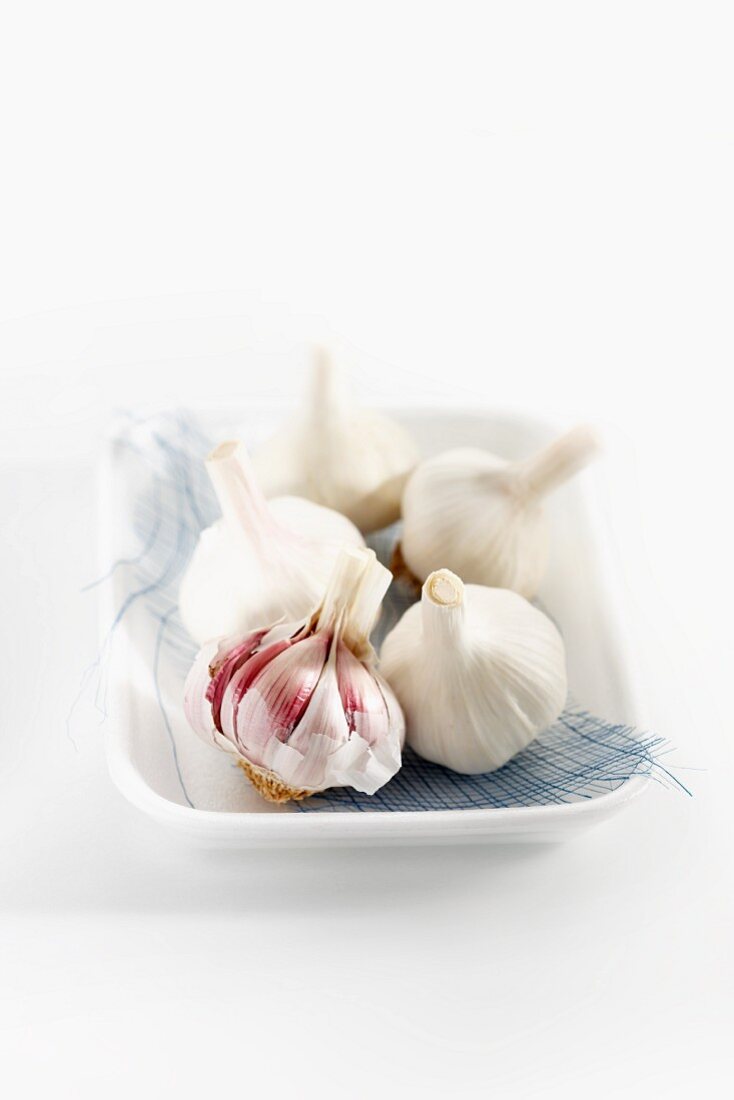 Heads of garlic on a plate