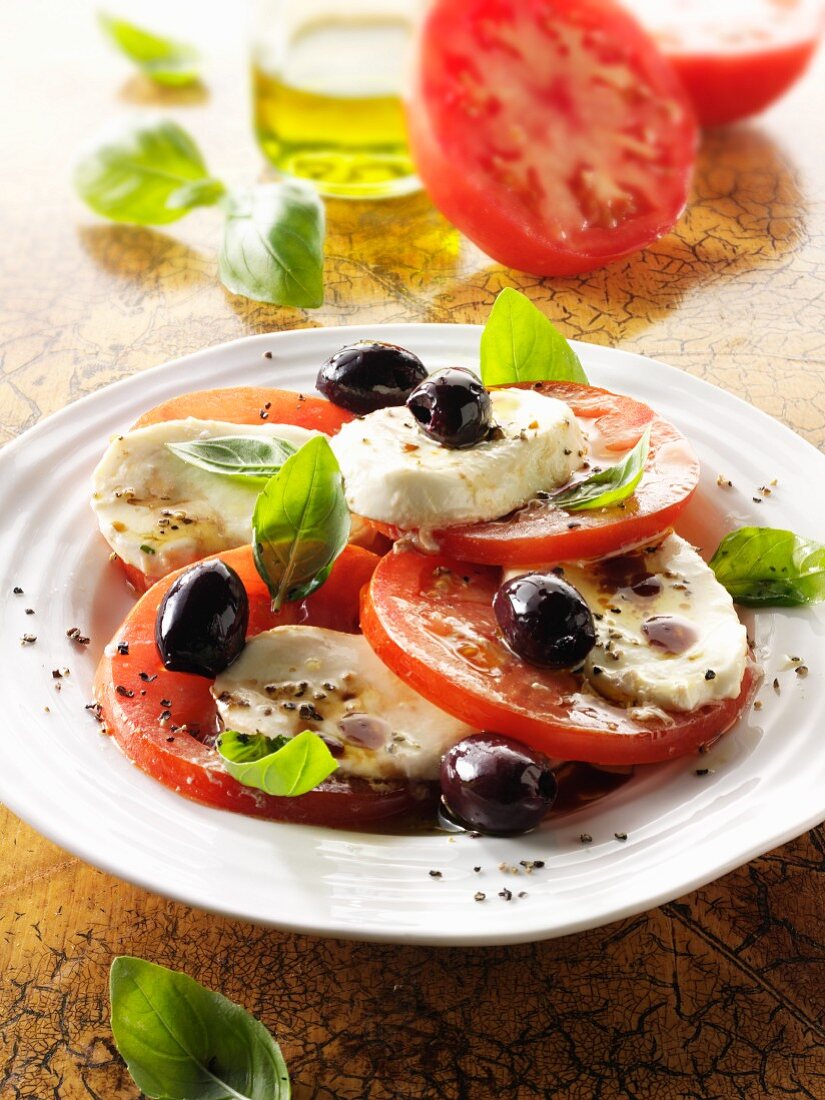 Caprese con le olive (tomatoes with buffalo mozzarella and olives)