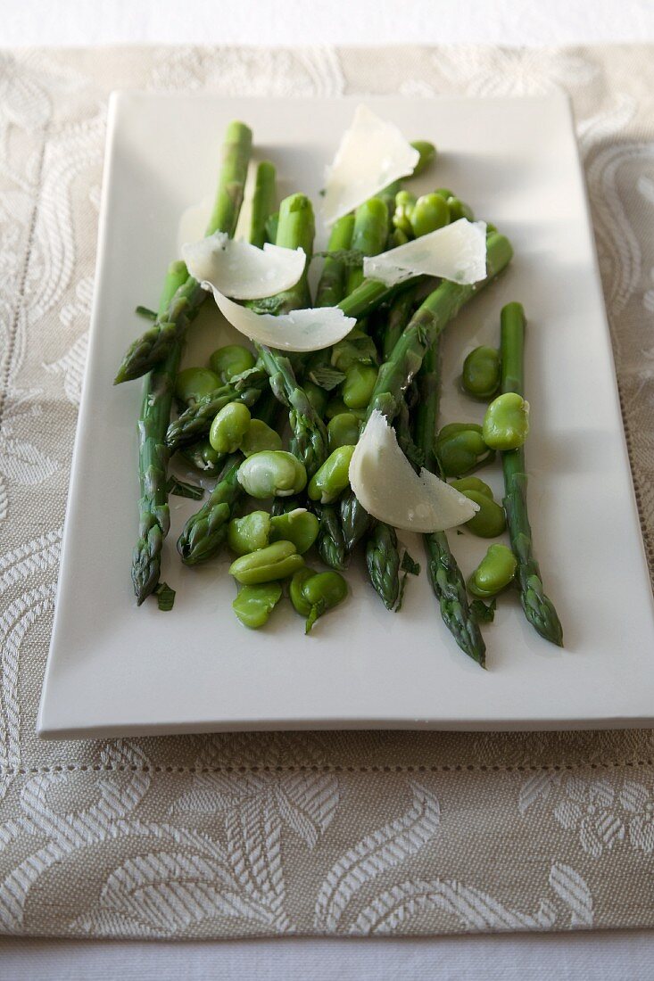 Asparagus and Broad Bean Salad with Shaved Cheese on a Platter