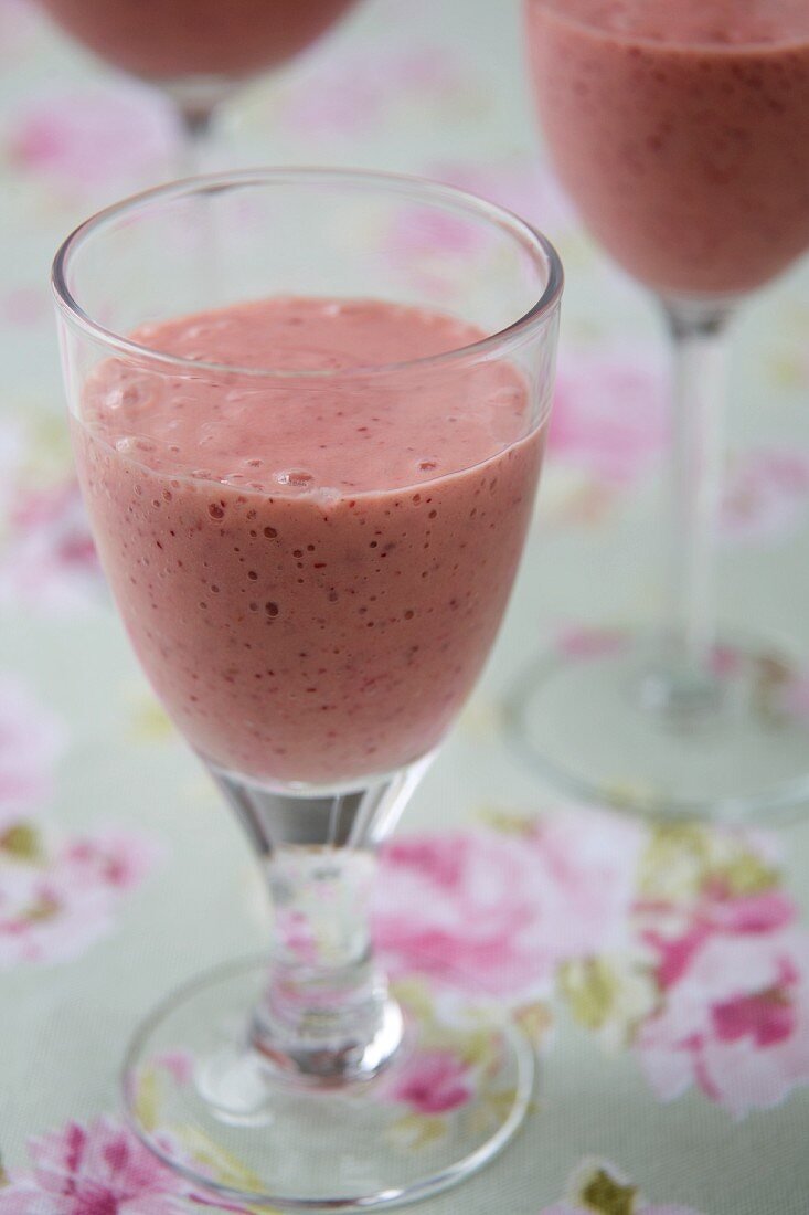 Cranberry and Strawberry Smoothies in Stem Glasses