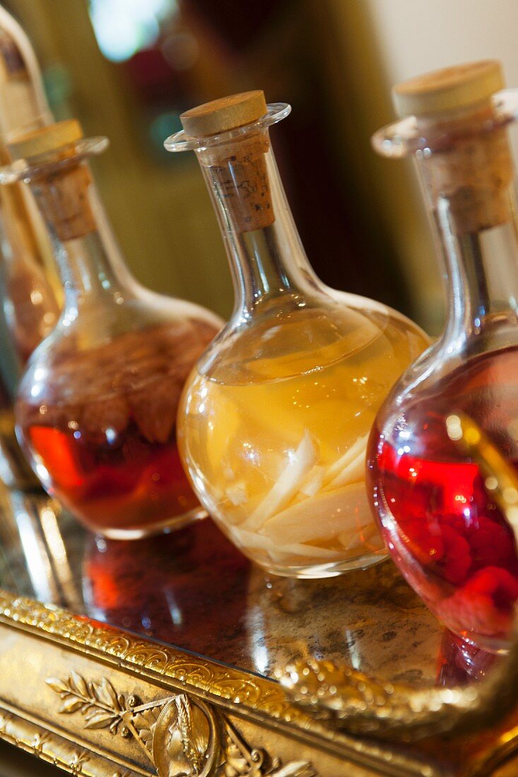 Preserved fruit in bulbous bottles with corks