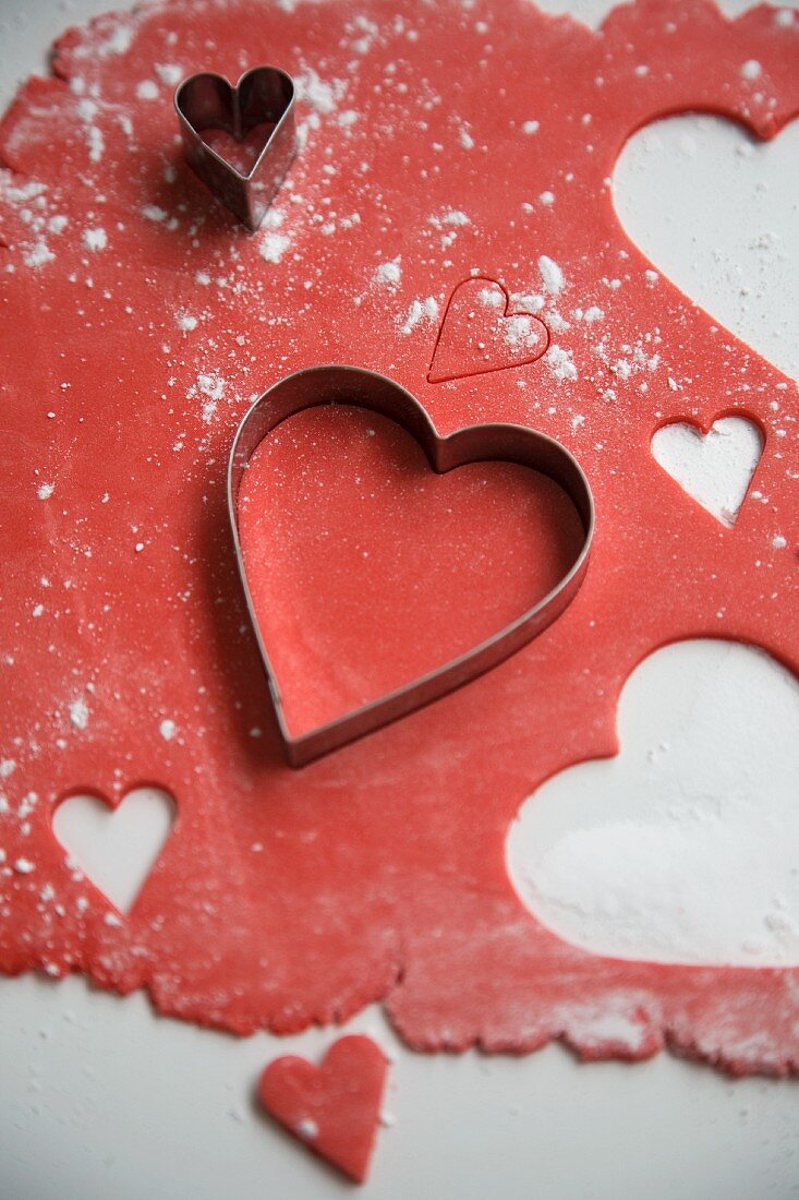 Red biscuit pastry with heart-shaped cutters