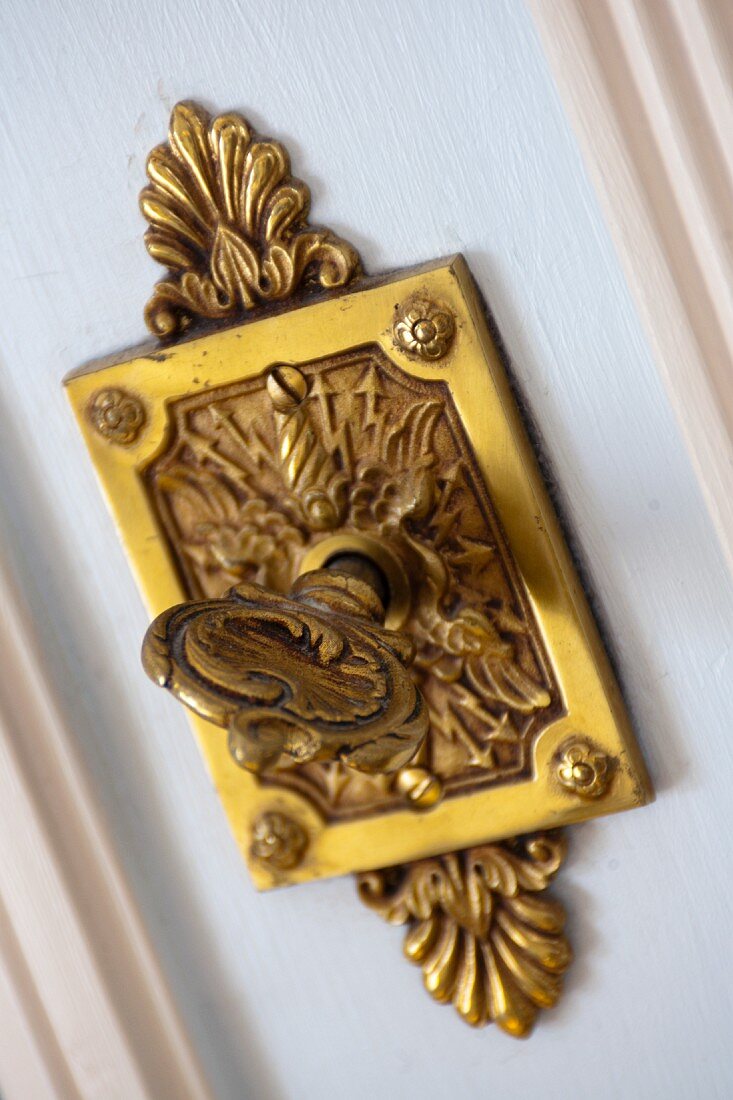 An antique key in a hotel room door